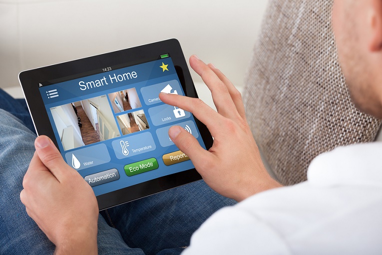 "man typing on ipad smart home"