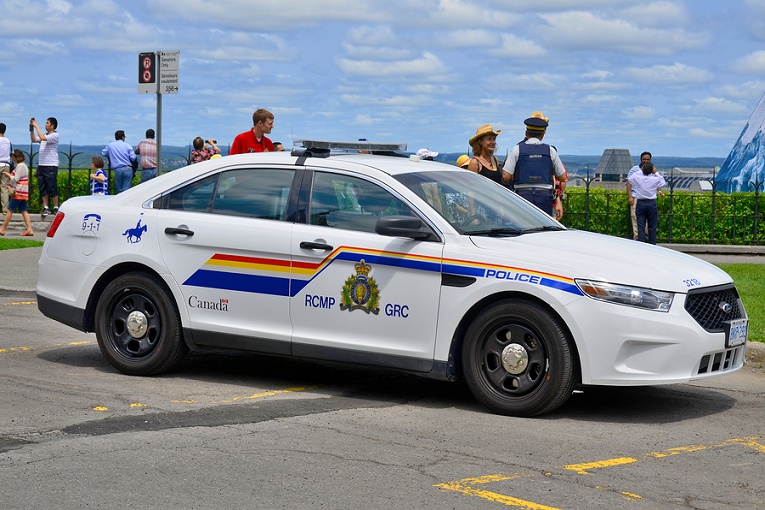 RCMP Police car in front of people Canada