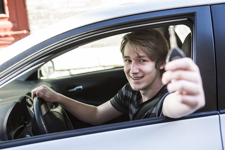 "young man holding keys"