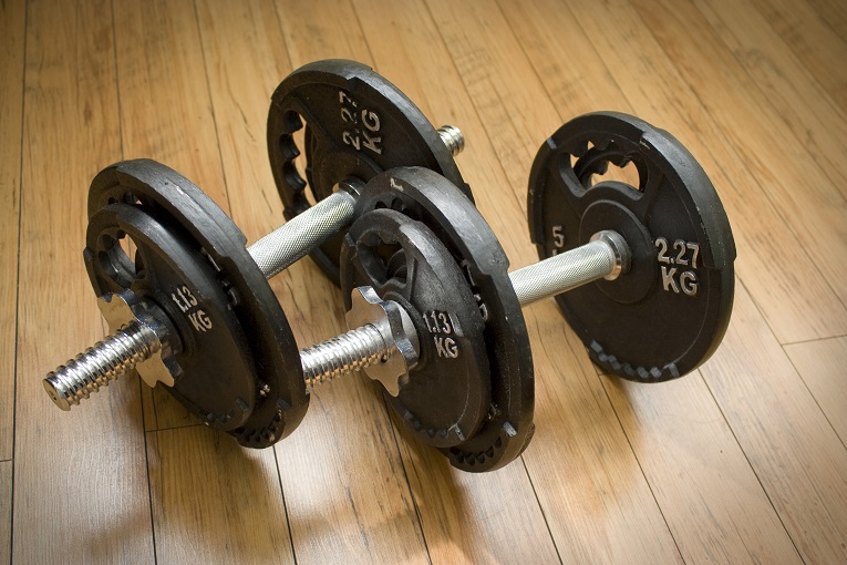 2 dumbells with 1.13 and 2.27 KG weights on ends