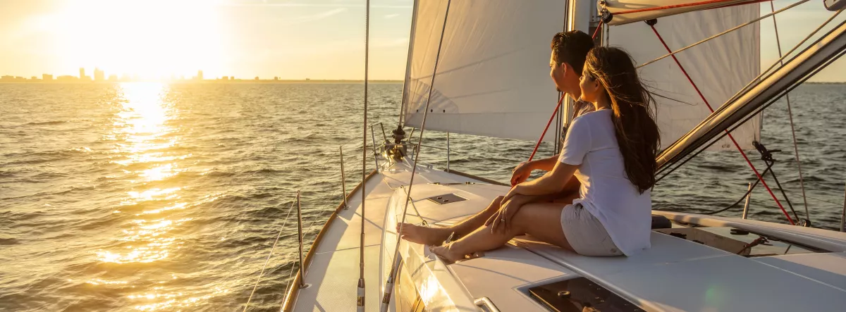 People on a boat at sunset
