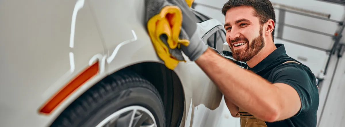 Person cleaning their car