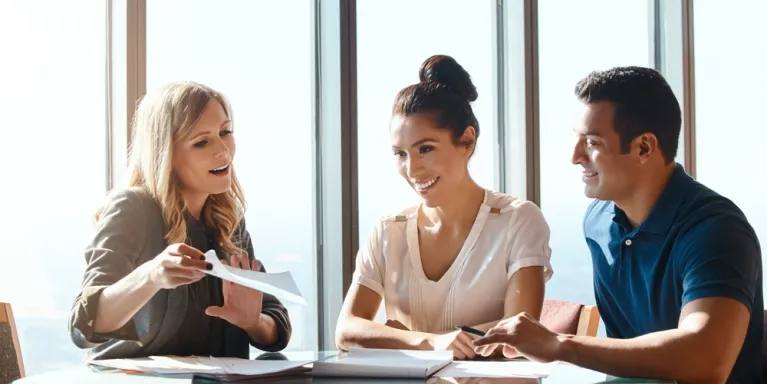 people reviewing insurance paperwork