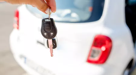 car keys in front of white car
