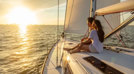 People on a boat at sunset