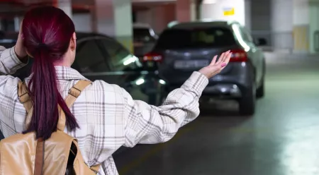 woman in parking garage looking for her car