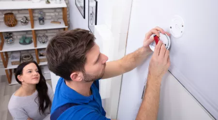 people testing the CO alarm