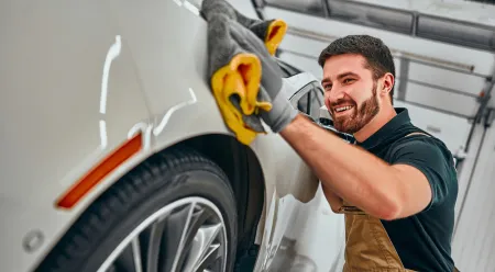 Person cleaning their car