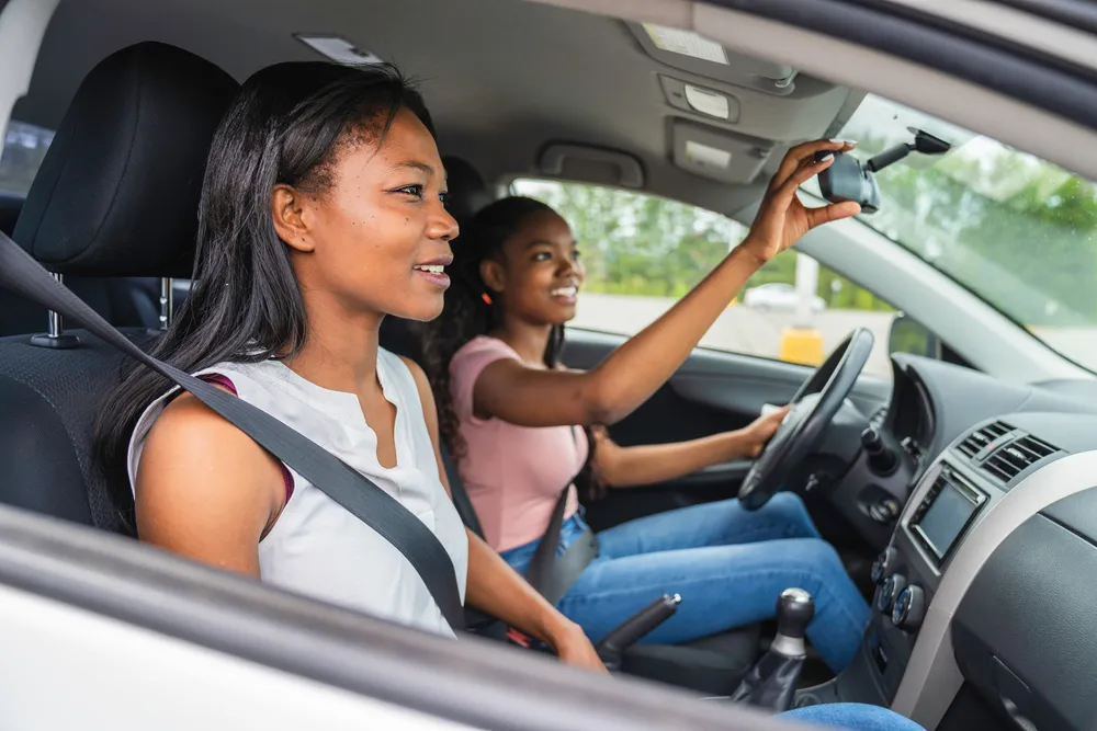 Young people driving car