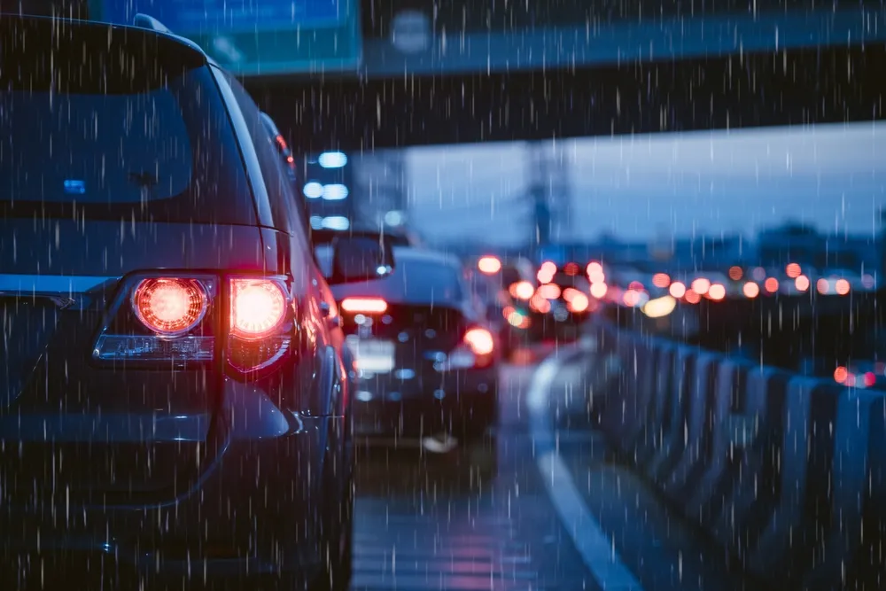 cars driving on highway at dusk